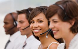 Group of happy call center employees with headset